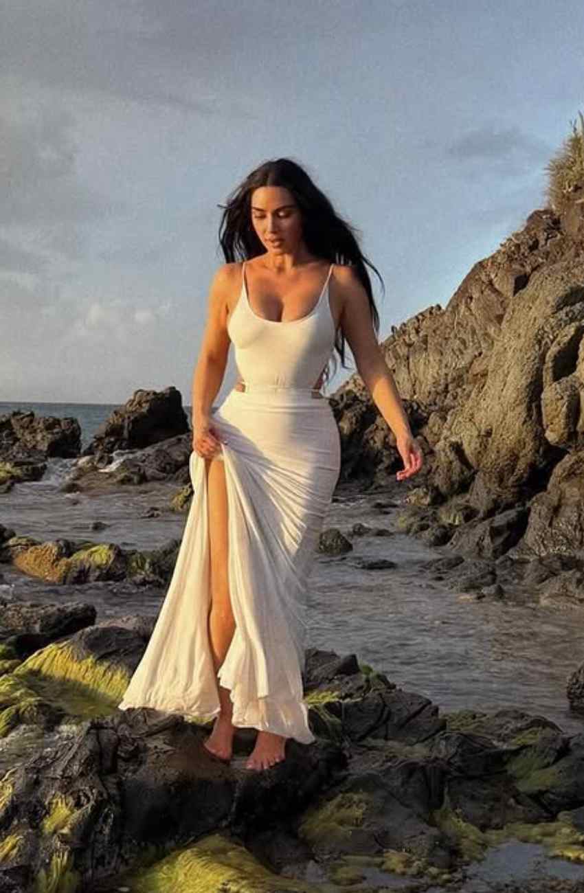 Kim Kardashian Wears Vintage-Inspired Sheer Lace Dress by the Sea