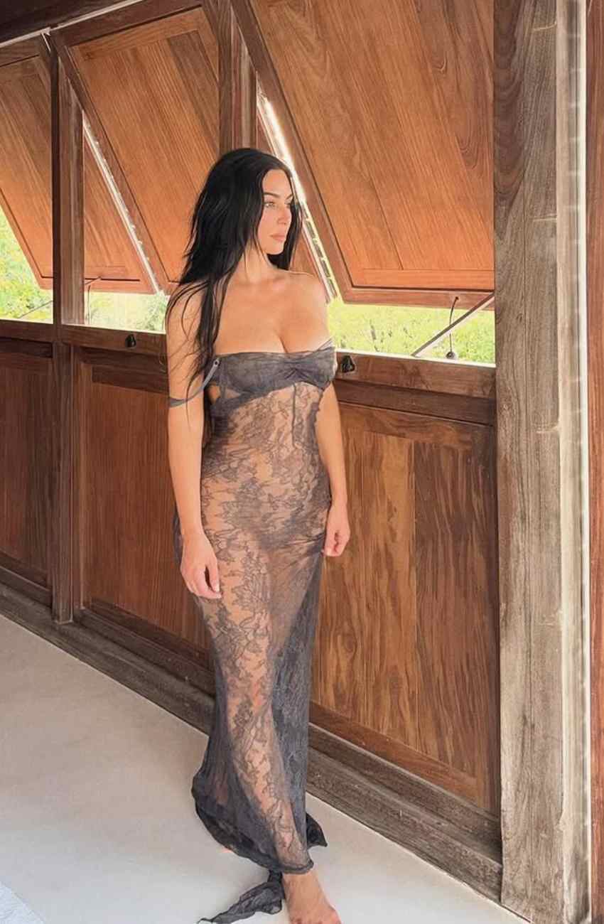 Kim Kardashian Wears Vintage-Inspired Sheer Lace Dress by the Sea