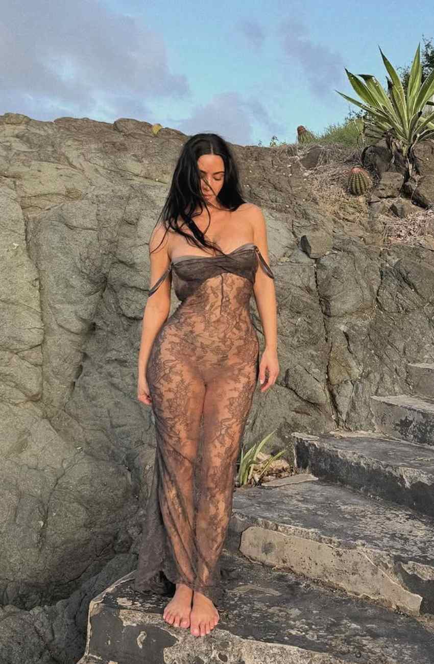 Kim Kardashian Wears Vintage-Inspired Sheer Lace Dress by the Sea
