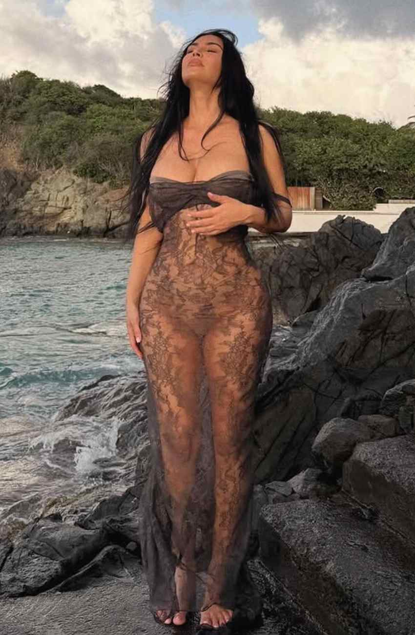 Kim Kardashian Wears Vintage-Inspired Sheer Lace Dress by the Sea