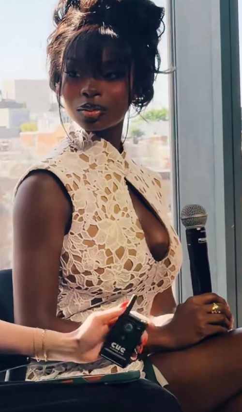 Love Island Star Ndidi Nwosu Stuns in Crimson Fur and Sheer Lace at SI Swimsuit Event