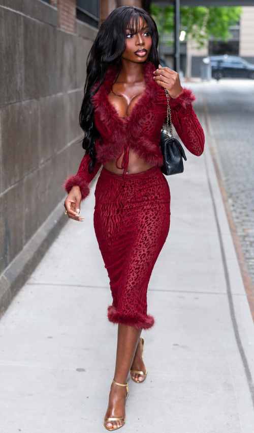 Love Island Star Ndidi Nwosu Stuns in Crimson Fur and Sheer Lace at SI Swimsuit Event